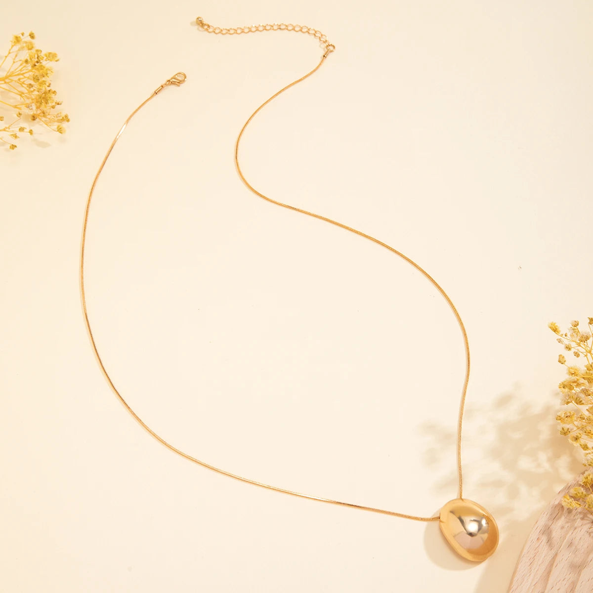 Elegant Elliptical Ball Pendant Necklace